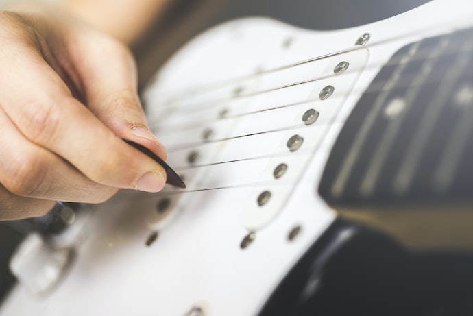 Apa guna pick gitar?