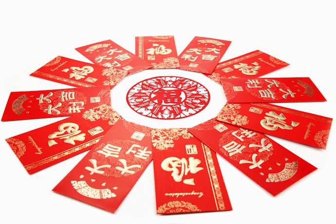 Apa arti warna dan tulisan pada angpao?