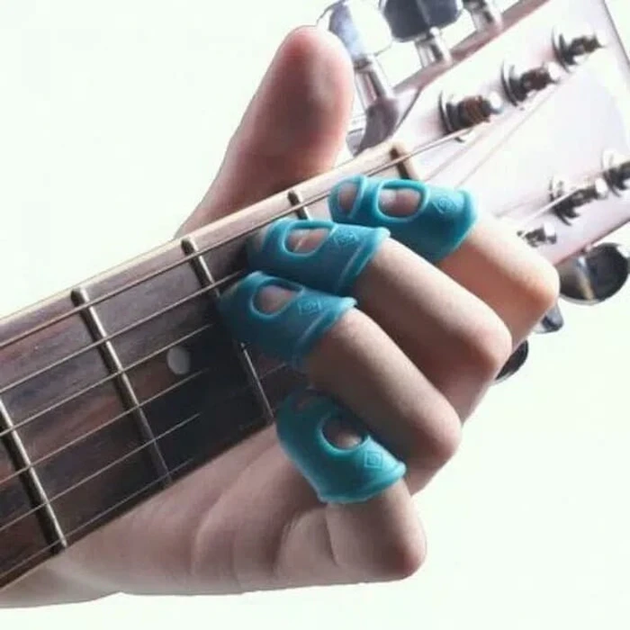 Silicone Finger Pick 4 Pcs Translation missing: id.activerecord.decorators.item_part_image/alt