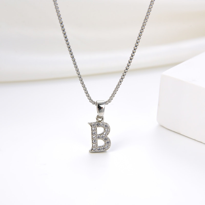 Kalung Titanium Huruf 3