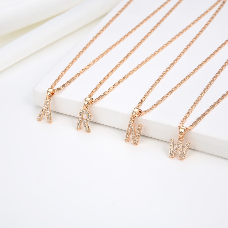 Kalung Titanium Huruf 4