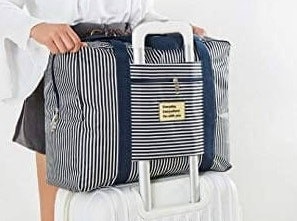 Pastikan ukuran back strap (lubang selipan) pas dengan handel koper